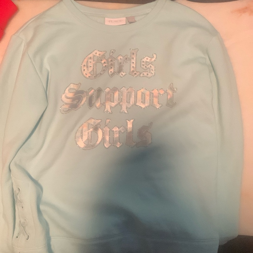 I am selling a cute baby blue motivational crew neck!!